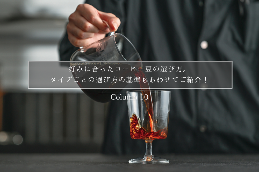 Person pouring a drink into a glass on a table.